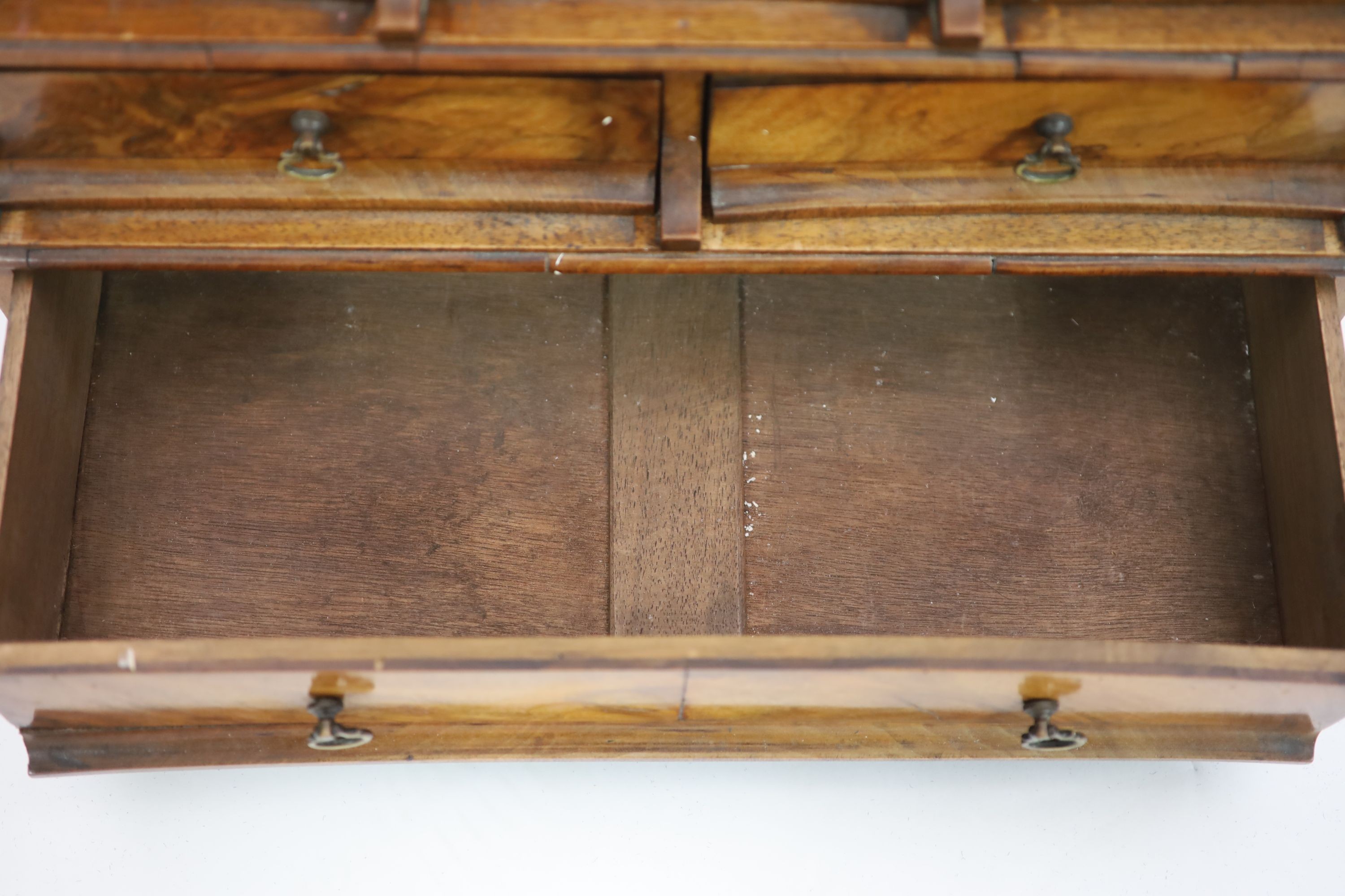 A Queen Anne walnut toilet mirror, W.46cm D.22cm H.77cm